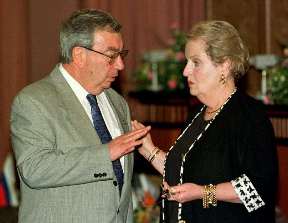 The captions should just say, U.S. Secretary of State Madeleine Albright with Evgeny Primakov.