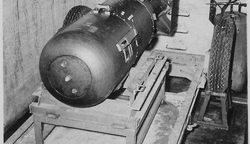 “Little Boy” bomb on trailer cradle in pit below the B-29