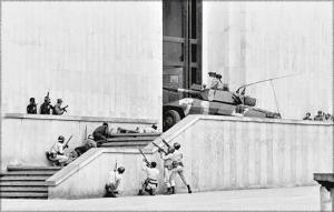 A Colombian Army cavalry regiment uses an EE-9 Cascavel armored car to breach and enter the Palace of Justice building