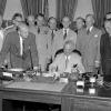 President Harry S. Truman at his desk in the Oval Office signing H.R. 5632, the National Security Act Amendments of 1949, August 10, 1949