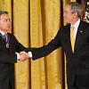 President George W. Bush congratulates President Alvaro Uribe of Colombia after presenting him with the 2009 Presidential Medal of Freedom Tuesday, Jan. 13, 2009, during ceremonies in the East Room of the White House