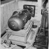 “Little Boy” bomb on trailer cradle in pit below the B-29