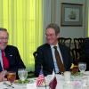 Donald H. Rumsfeld (left) shares a laugh with Peter W. Rodman (center)