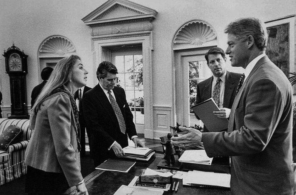 Katie McGinty, chair of the Council on Environmental Quality, engages with President Clinton in the Oval Office.