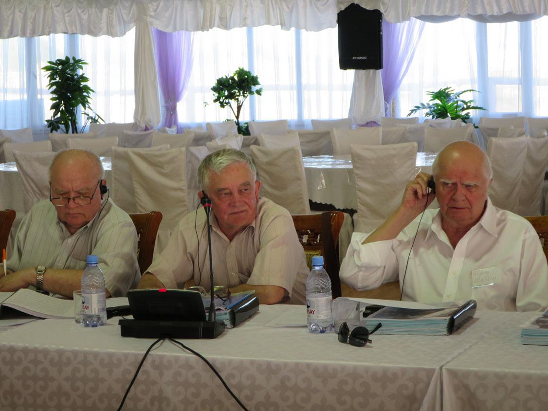 Three Russian Generals:  Viktor Esin, Anatoly Svetikov and Evgeny Maslin at a conference table in Astana, Kazakhstan, 2015