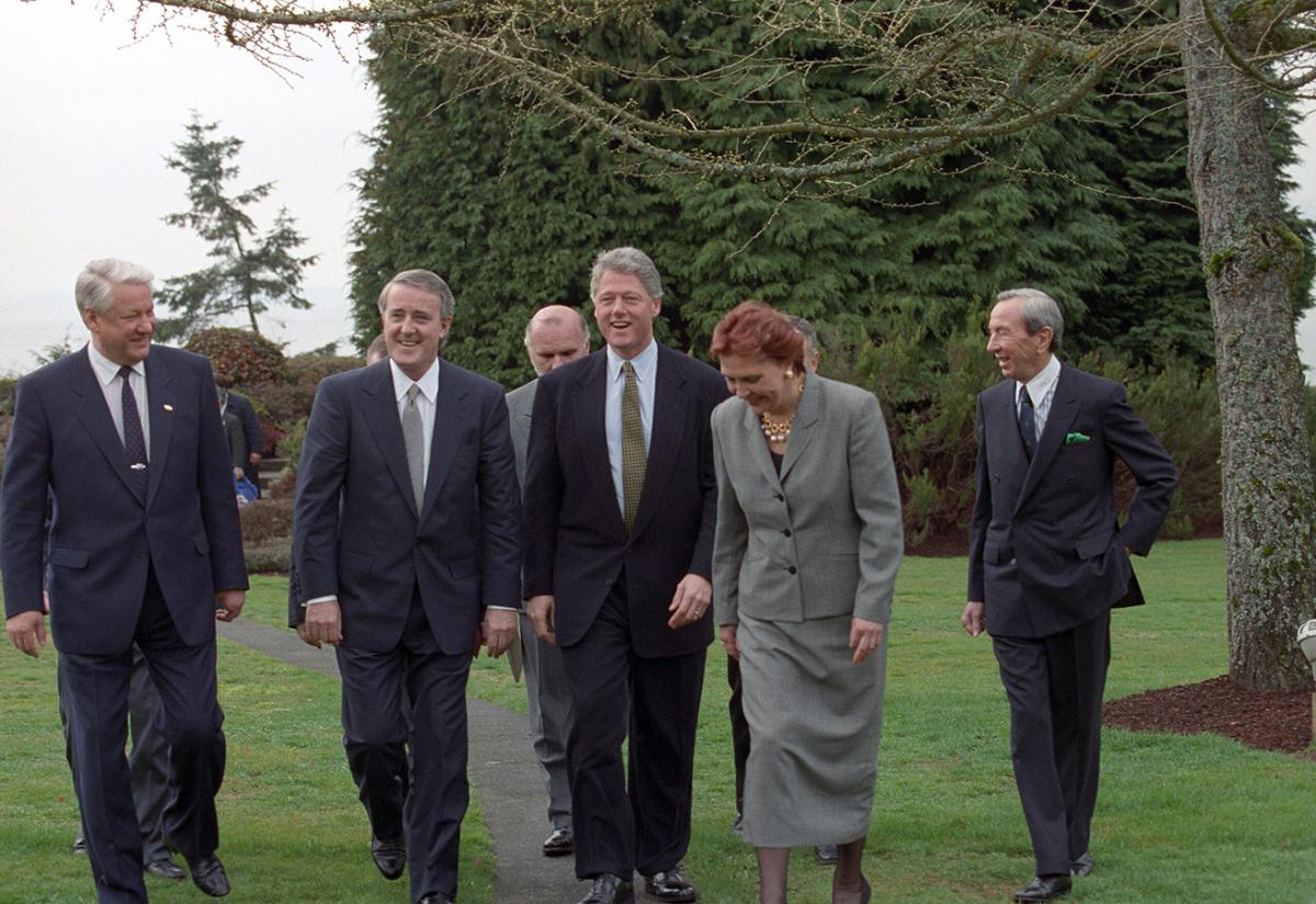 Photographs of President William Jefferson Clinton, Canadian Prime Minister Brian Mulroney, and Russian President Boris Yeltsin walking outside at the University of British Columbia President's residence. 3 April 1993