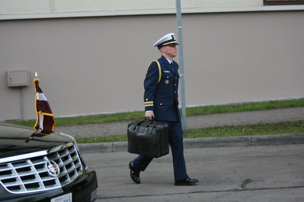With President Bush at the NATO Summit in Riga, Latvia, Military Aide Geoff Gagnier carries the Football, 28 November 2006. 