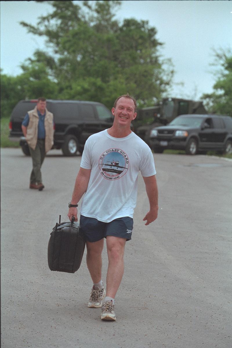 Military Aide Lt. Commander Steve Reynolds carries the Football at the Bush Ranch, Crawford, TX, 26 April 2002. Photo number P16499-07