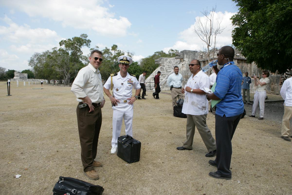 During meetings in Cancun, President Bush, Mexican President Fox, and Canadian Prime Minister Harper tour Chichen-Itza Archaeological Ruins, 30 March 2006. Military Aide Commander Leith Davids stands next to the Football. 