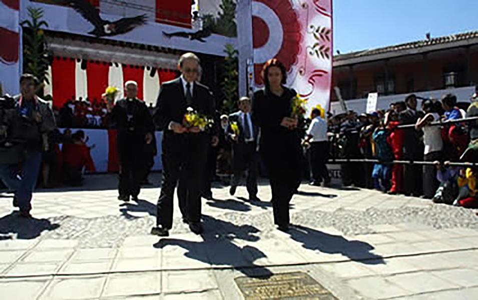 CVR commissioners Salomón Lerner and Sofia Macher bring flower to the final report celebrations in Ayacucho