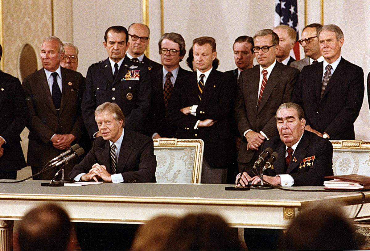 President Carter and Soviet General Secretary Leonid Brezhnev sign the Strategic Arms Limitation Talks II treaty in Vienna