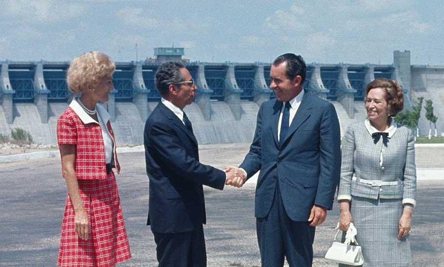 Presidents Richard Nixon and Gustavo Díaz Ordaz shake hands at a ceremony on the Mexico side of the Rio Grande River after dedicating the Amistad Dam, September 8, 1969