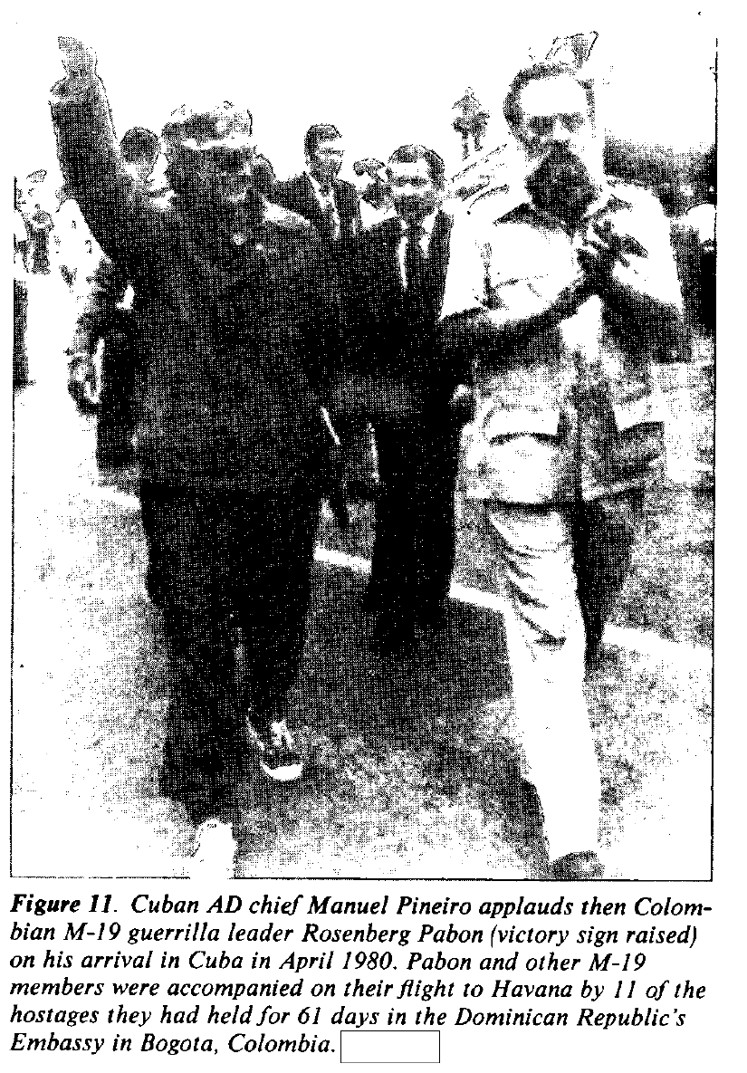 Cuban official Manuel Pineiro walks beside M-19 leader Rosenberg Pabon