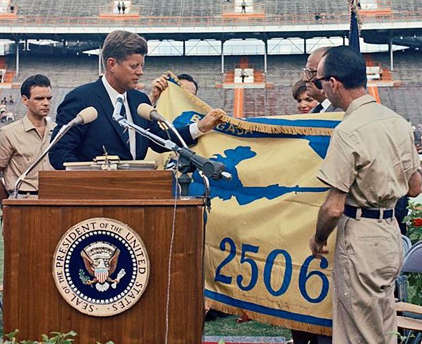 President Kennedy receives the flag of the 2506 Brigade 
