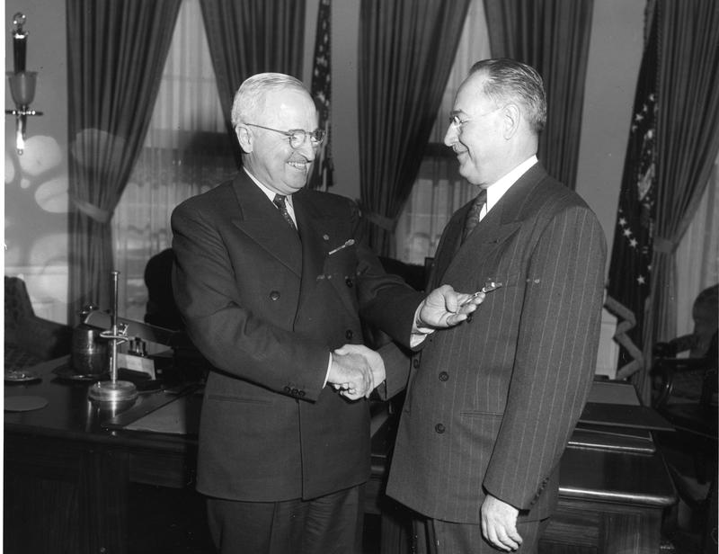 President Harry S. Truman (left) presents the Distinguished Service Medal to Rear Admiral Sidney Souers, U.S. Naval Reserve (right), 1 December 1952.  