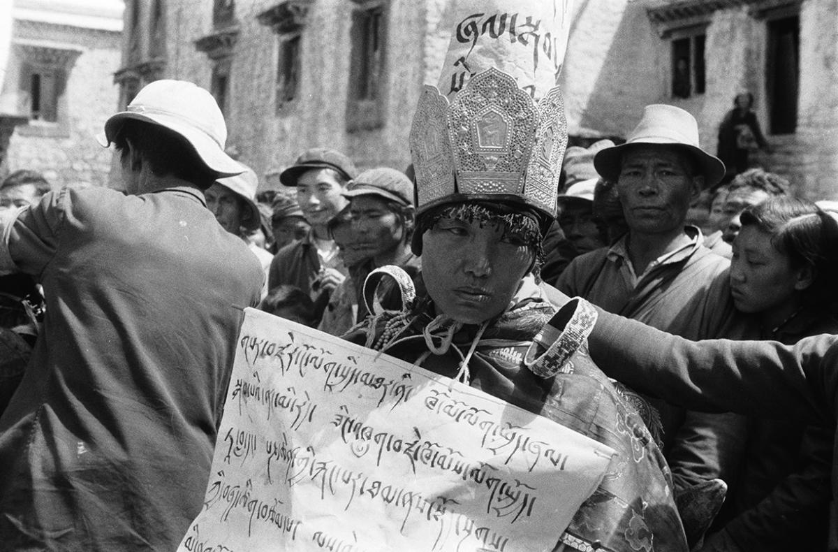 An officer in the People’s Liberation Army in Lhasa when the Cultural Revolution broke out in 1966, a Buddhist nun is forced to wear a sign labeling her as a counterrevolutionary