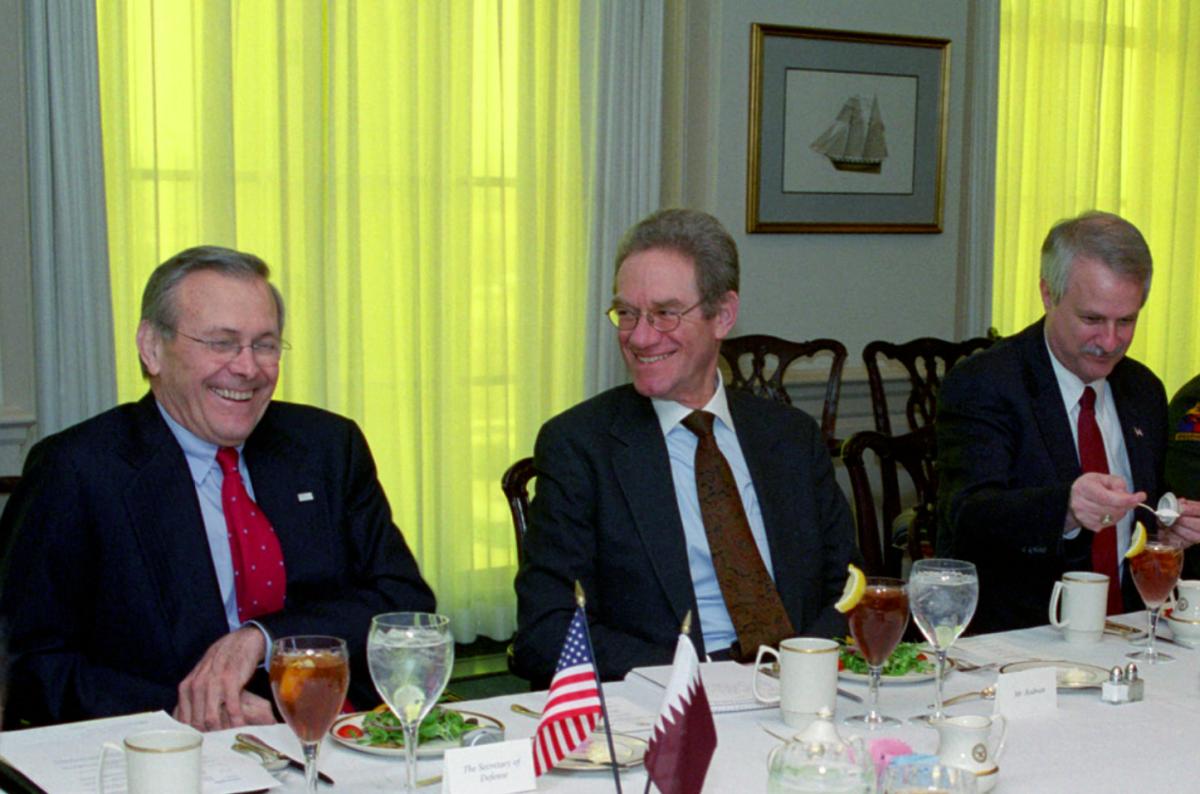 Donald H. Rumsfeld (left) shares a laugh with Peter W. Rodman (center)