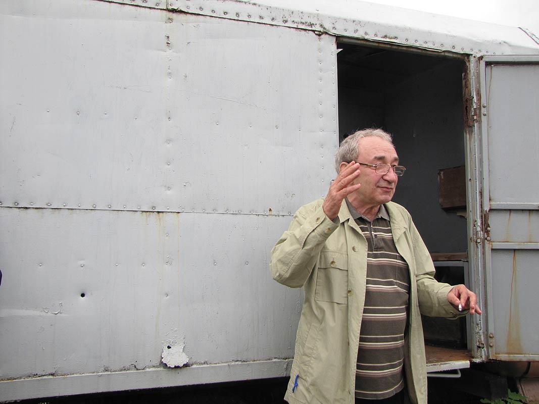 Roginsky at Perm 36 with the camp's prisoner transport van (photo by Svetlana Savranskaya)